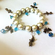 pearl stretch charm bracelet with bows