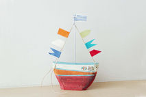 Ceramic sailing boat with colourful flags