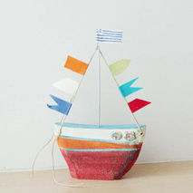 Ceramic sailing boat with colourful flags