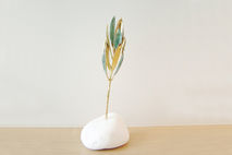 Real olive branch eco sculpture on white stone