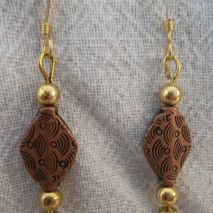 copper-colored diamond earrings