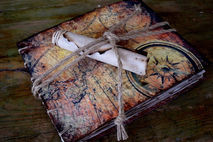 Travel photo album scrapbook, depiction of compass and ancient m