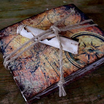 Travel photo album scrapbook, depiction of compass and ancient m