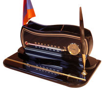 Simple office desk organizer made from obsidian with clock, flag