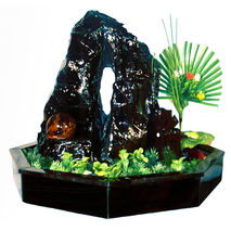 Tabletop water fountain made of obsidian with artificial plants