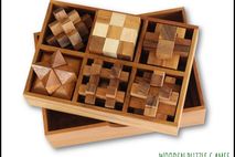 Set of 6 Puzzles in a wooden Box